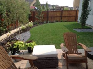 Backyard Seating Area and Lawn Landscape by European Garden Design Calgary