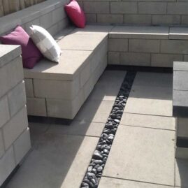 Comtemporary Stone Patio with Fireplace and Seating in Daytime Contemporary European Garden Design Calgary