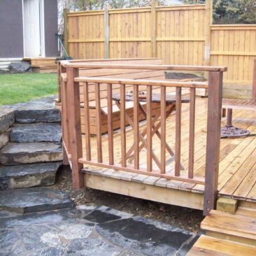 Stonework Fencing and Deck with Railing in Decks and Fences by European Garden Design Calgary