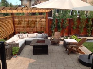 Modern Patio with Outdoor Seating and Fireplace by European Garden Design Calgary_o