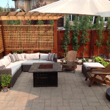 Modern Patio with Outdoor Seating and Fireplace by European Garden Design Calgary_o