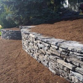 Stone Work Retaining Wall from the Side by European Garden Design Calgary